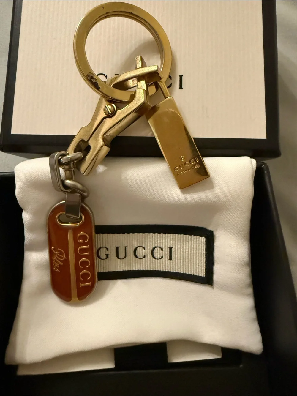 Gucci Plus mixed metal and red enamel keychain
